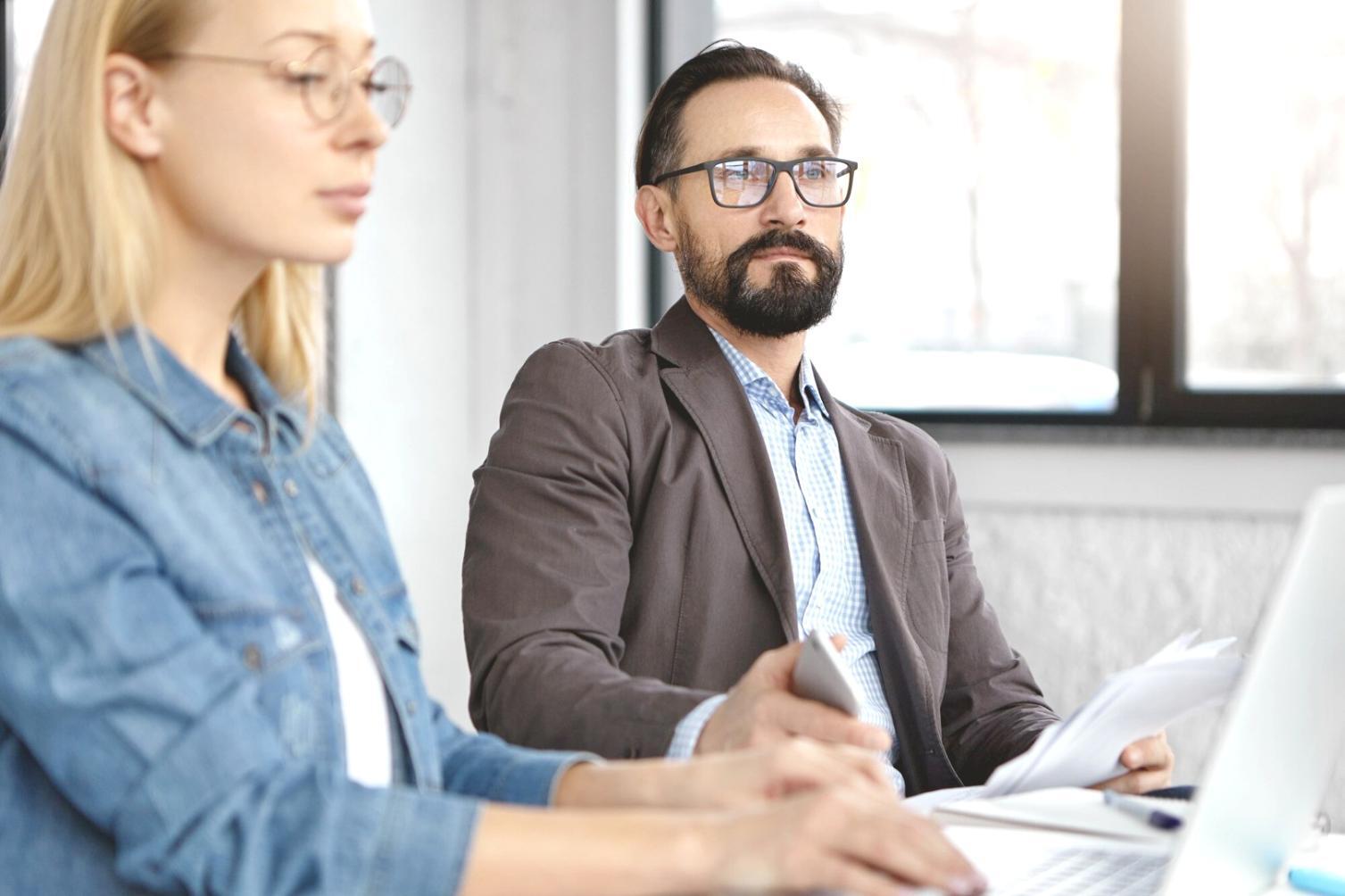 Financial analyst reviewing valuation models on multiple monitors
